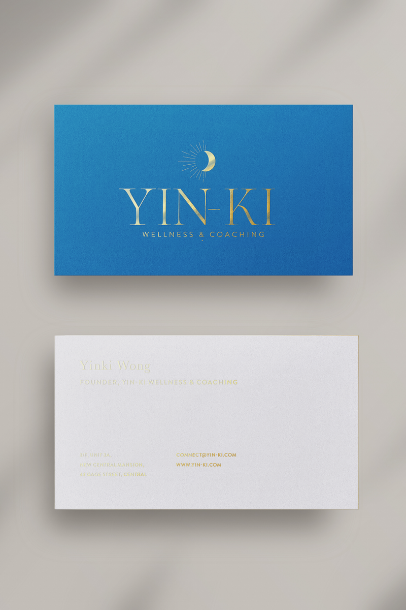Blue, white and gold business cards for wellness coach.