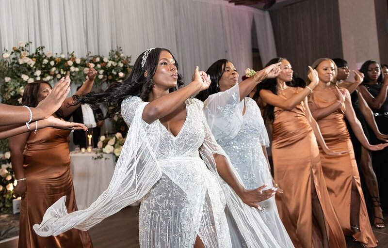 Bride and her sorority doing an AKA stroll at a wedding reception