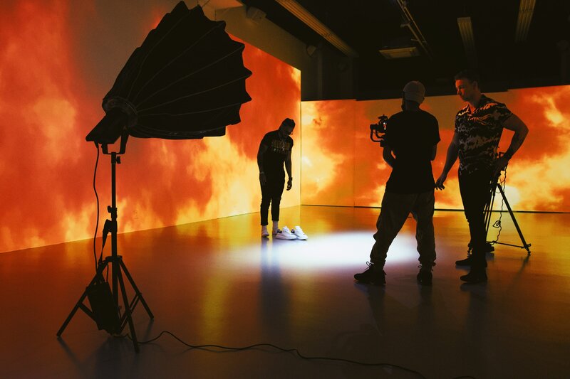 Behind-the-scenes of cinematic brand video production using LED wall and dynamic lighting setup