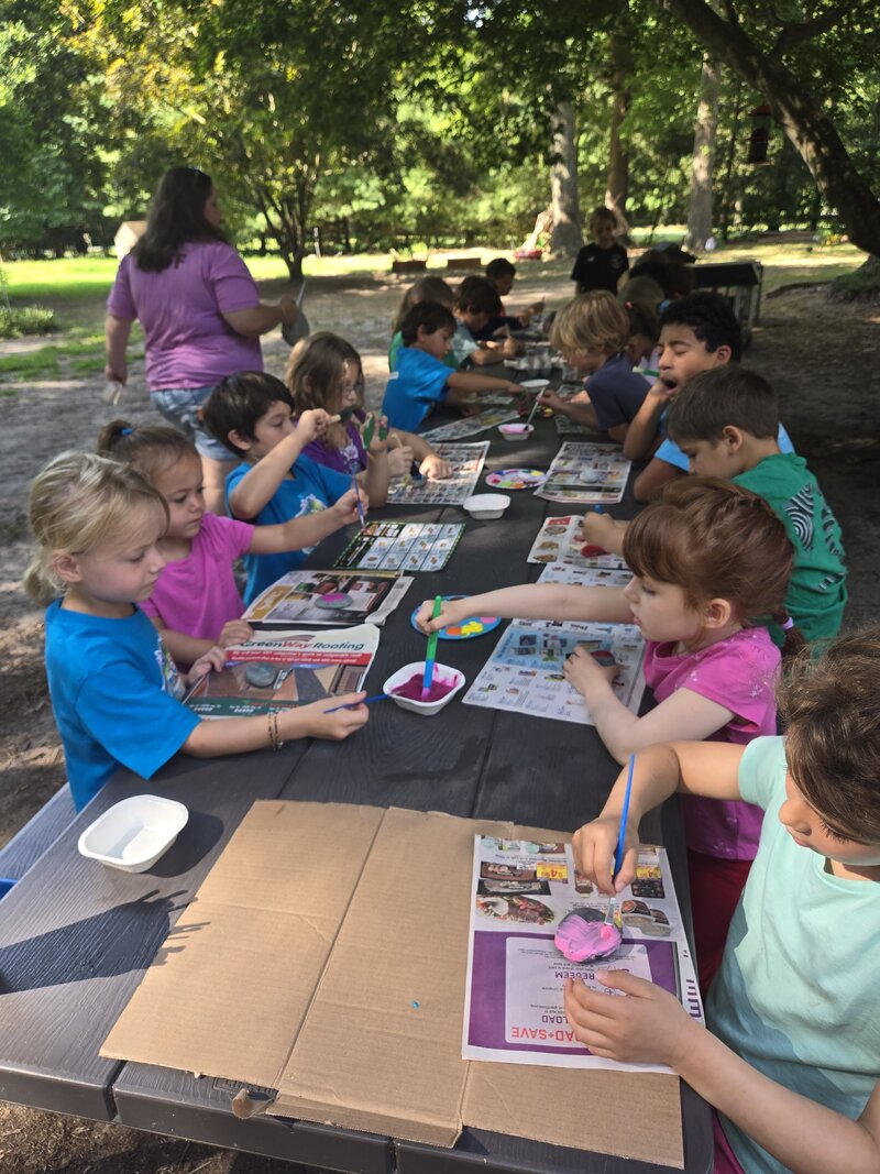 Children working on a hands-on project at ROOTS