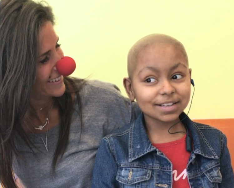 Therapist and child smiling