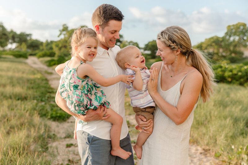 family playing on beach