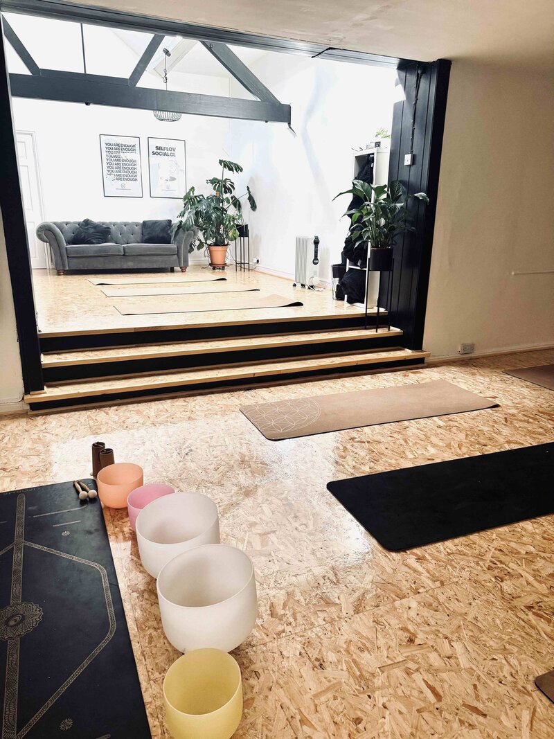 Image of a yoga and pilates studio in Somerset set up with mats and sound bowls
