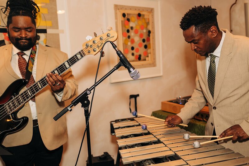 Live musicians playing at Dart Collective Chicago launch party at Lou Lou by Lola Cafe