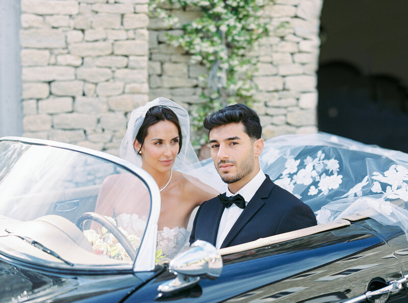 The Groom driving the car like James Bond