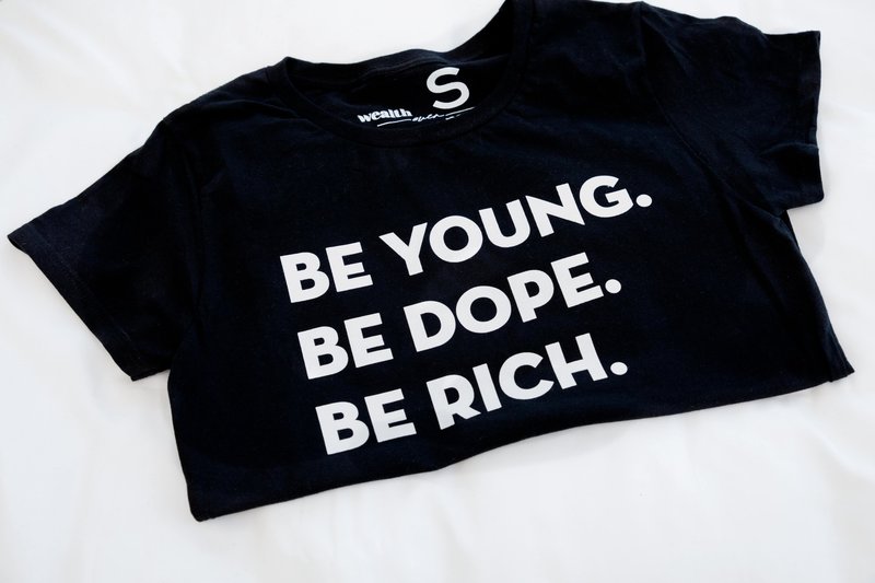 Black shirt with the words Be Young Be Rich Be Dope