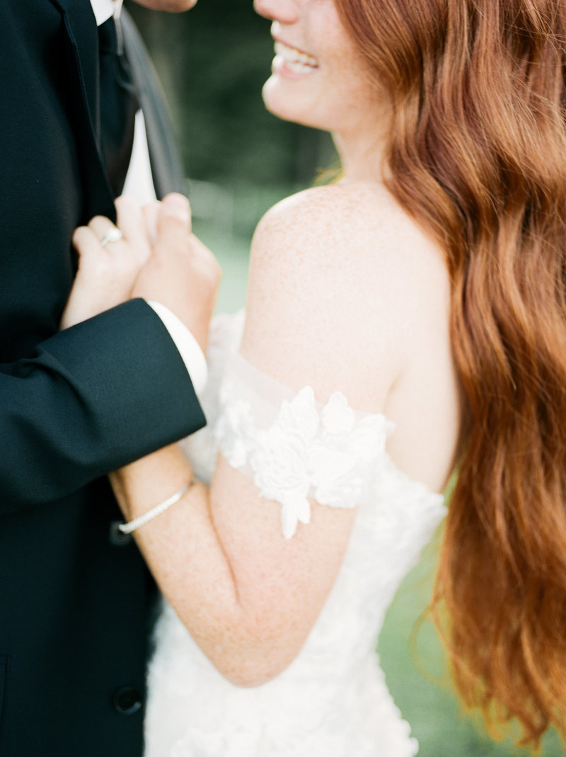 bride and groom holding hands on wedding day