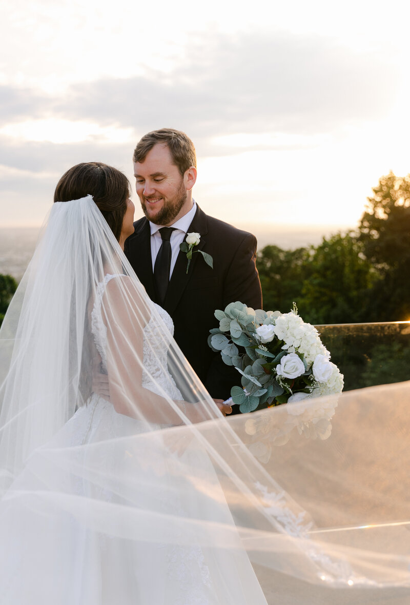 Bride and groom walk up memorial steps at their DC wedding