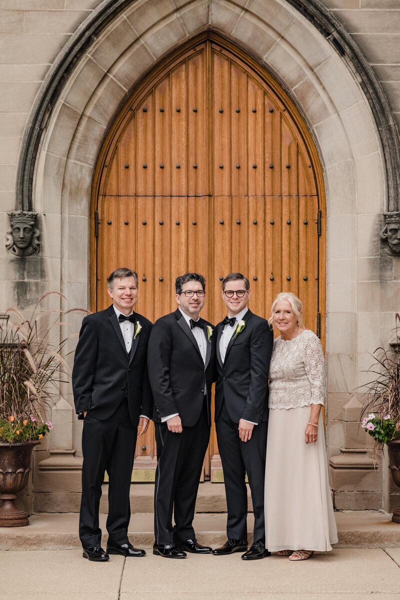 Grooms and their family outside a Chicago church