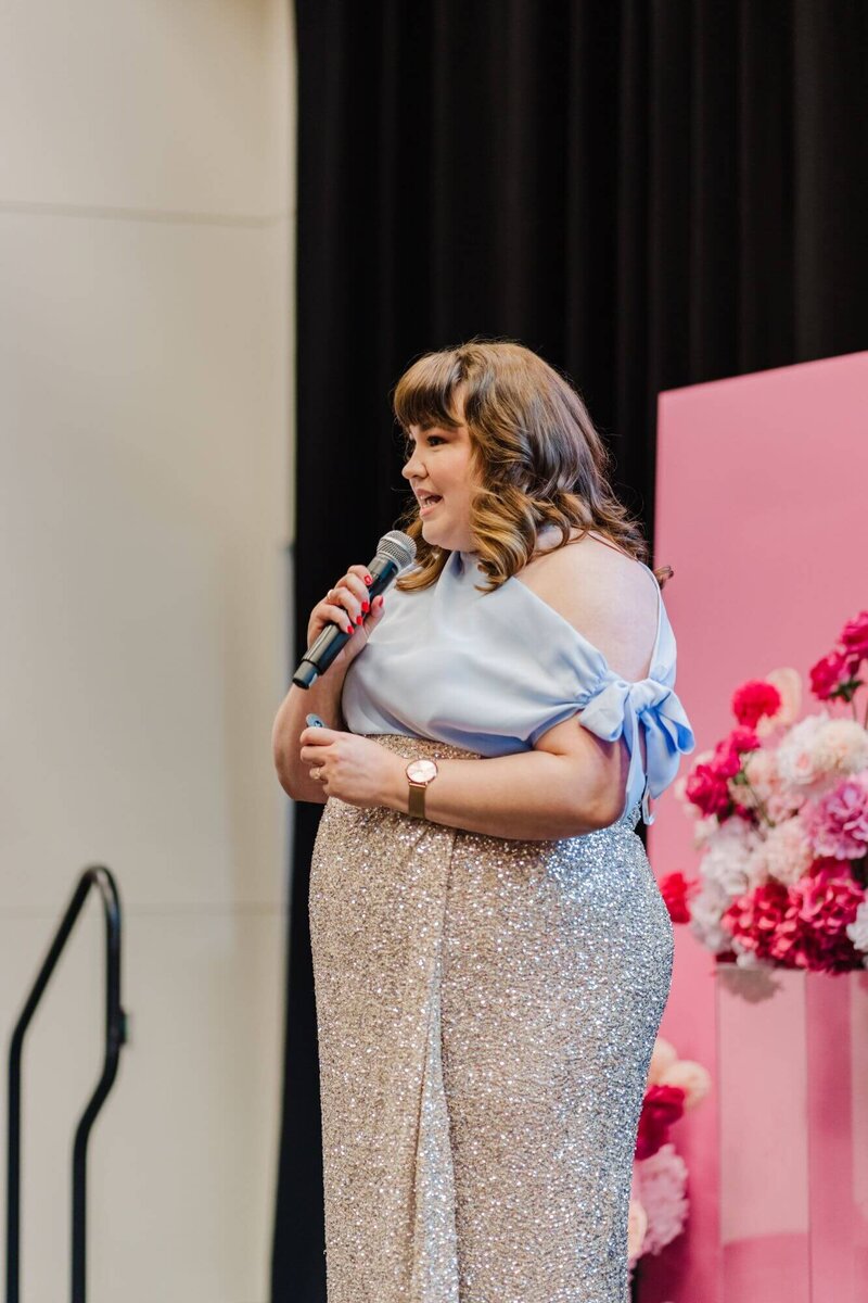 Close up of Leith's hands looking through colour swatches for a branding project