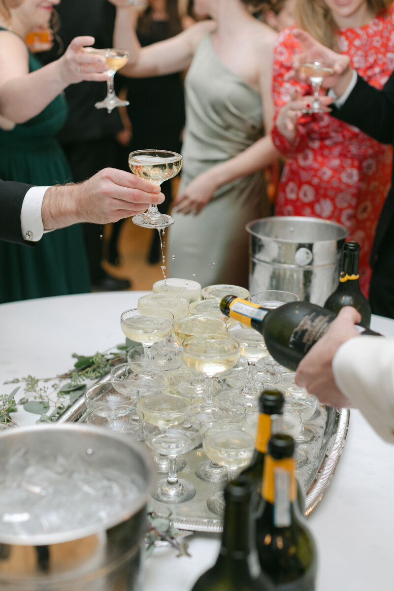 guest-cheers-champagne-tower-reception