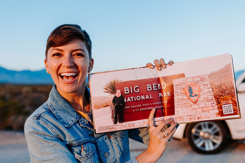 published author holding photo book in big bend national park