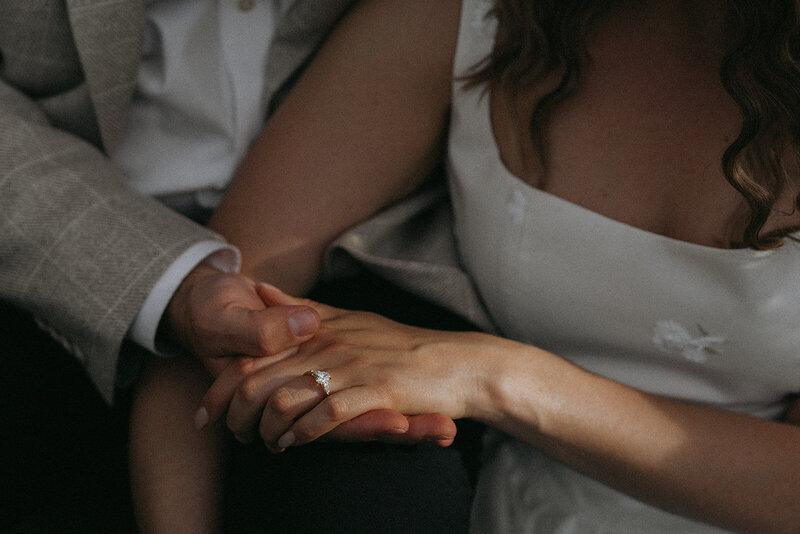 couple holding hands with ring for engagement photography, captured by Elsie Goodman, an NYC engagement and couples photographer