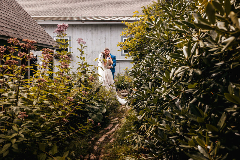 Couple looking at each other during a first look at cobb hill estate by NH wedding photographer Lisa Smith