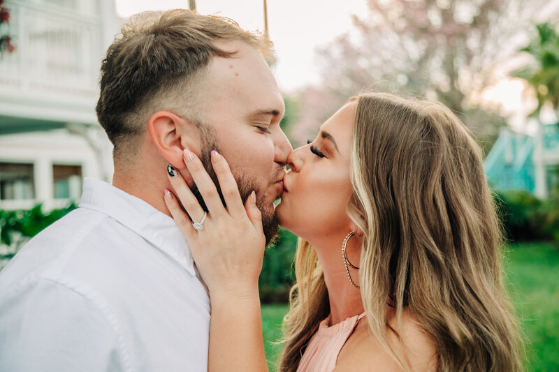 Couple kissing, just engaged, proposal at Disney's resort