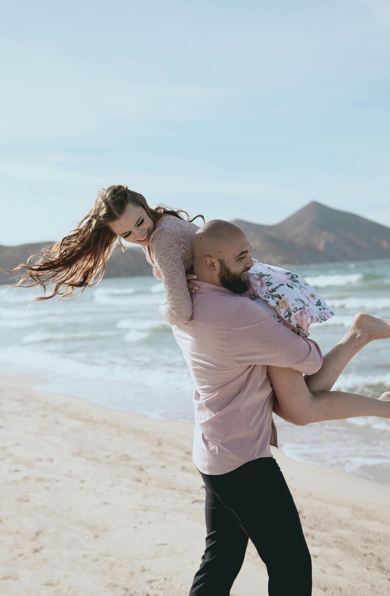 couple on beach on honeymoon
