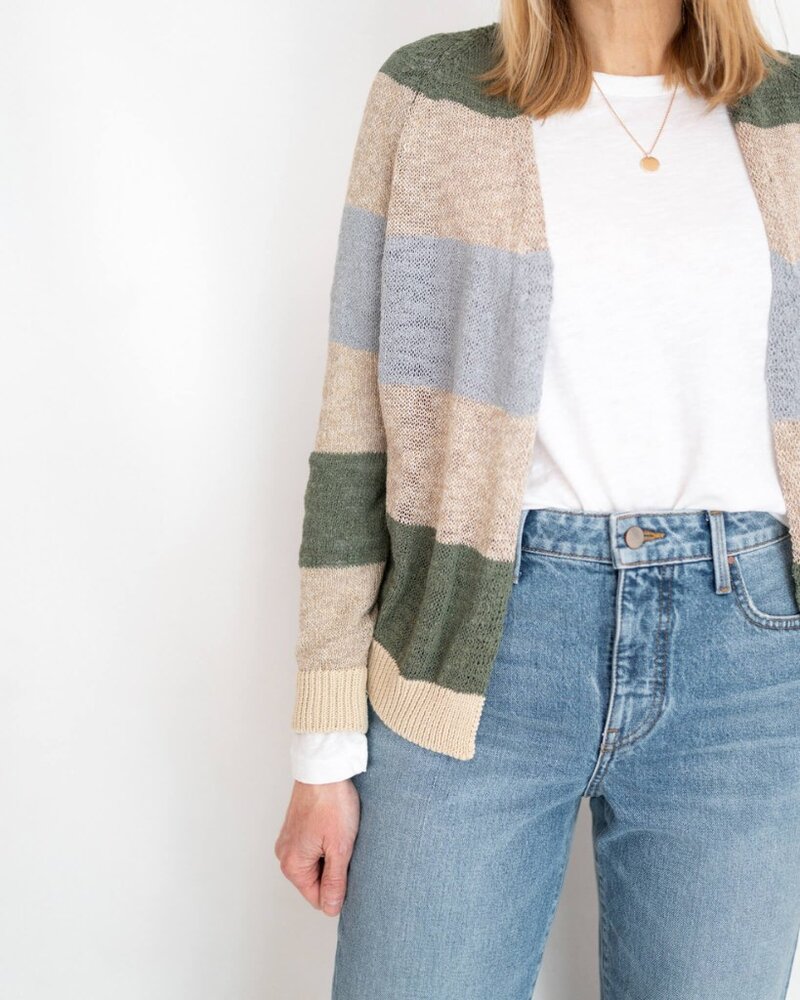 lady standing wear jeans and jumper