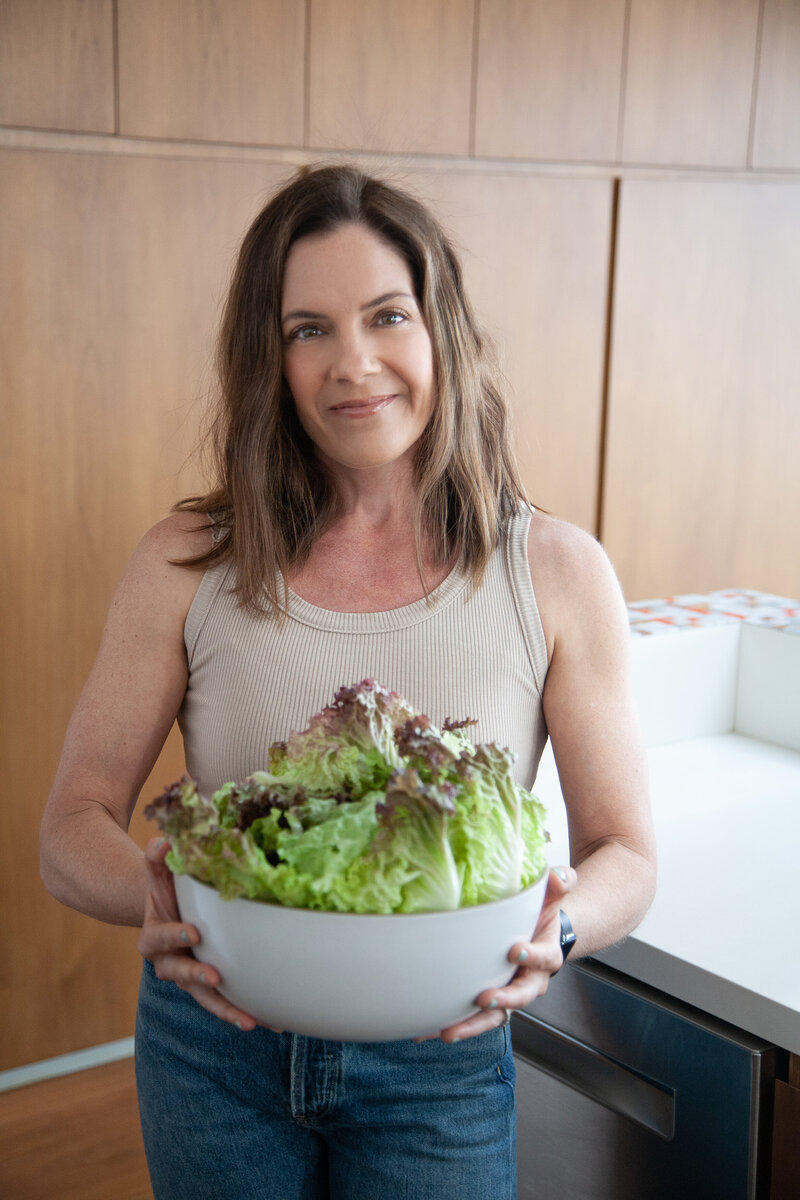Hailey Soren holding a bowl of salad.
