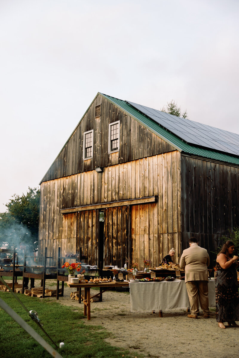 beautiful photo of broadturn farm cocktail hour with food cooking at wedding