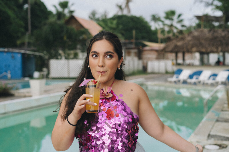 Latina Designer Sipping On Cocktail