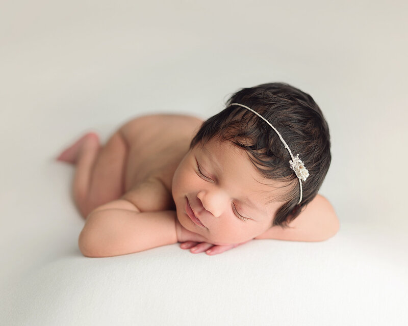 Newborn baby girl in pink Medford newborn photographer