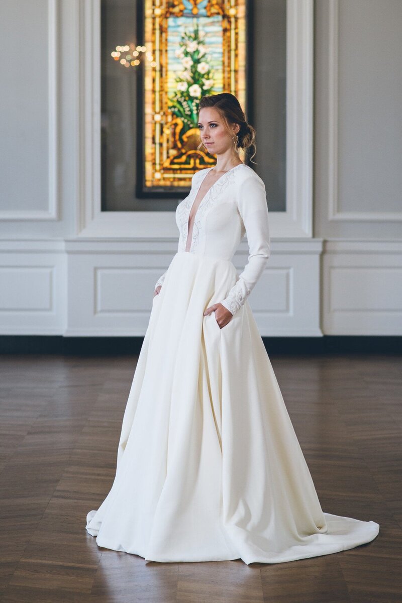 long-sleeve ballgown wedding dress with pockets
