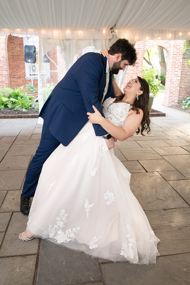 Bride and groom smiling while dancing