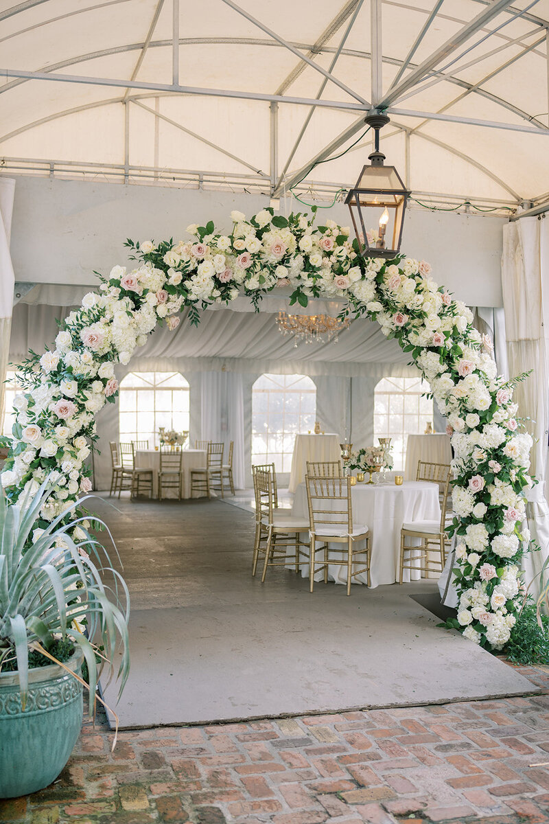 floral arch design at luxury wedding reception in New Orleans