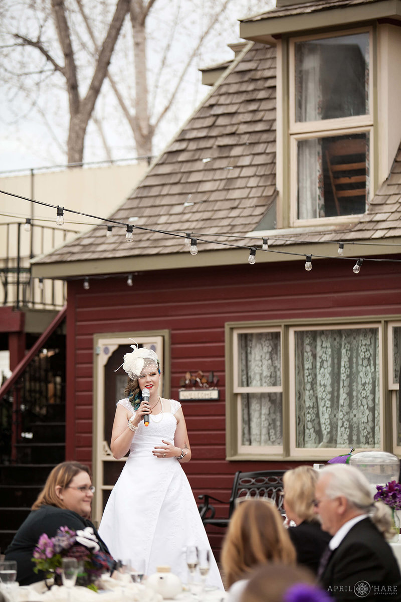 Bride toast on the back patio at McCreery House historic victorian home in Loveland Colorado