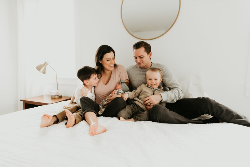 family in their home with a newborn