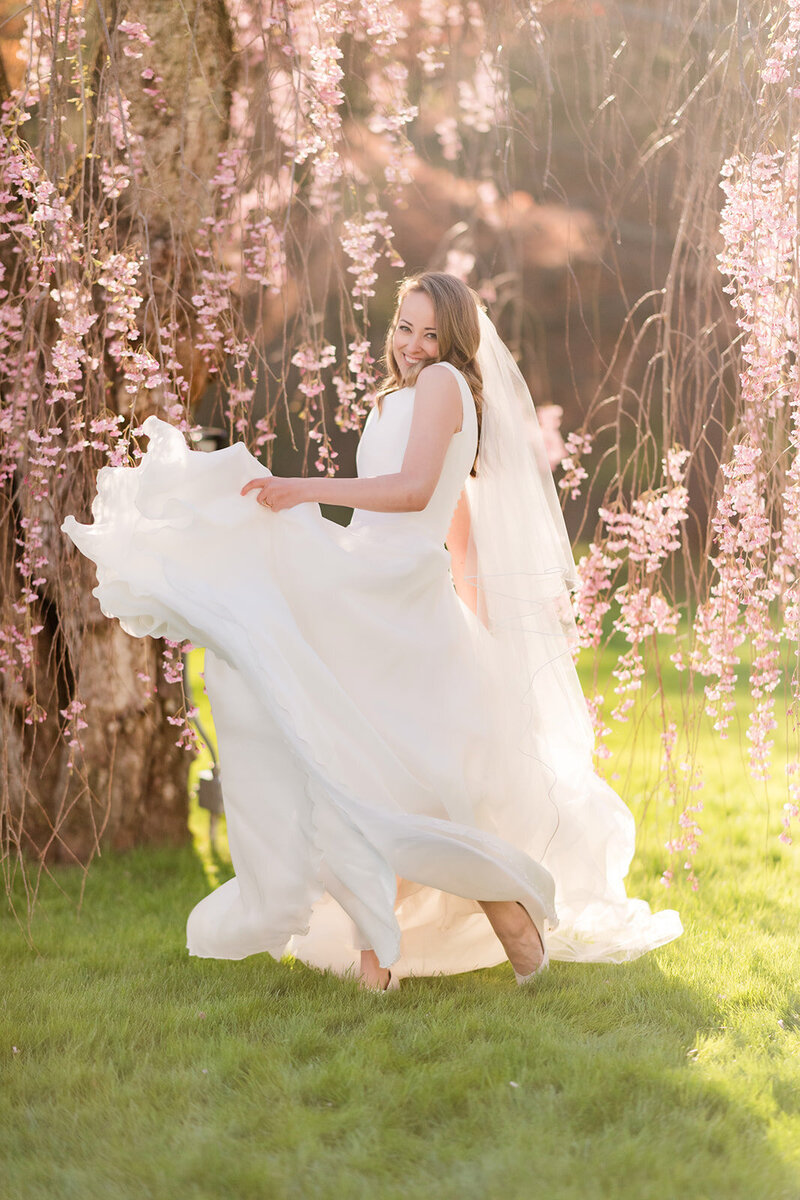 bride twirls in wedding dress