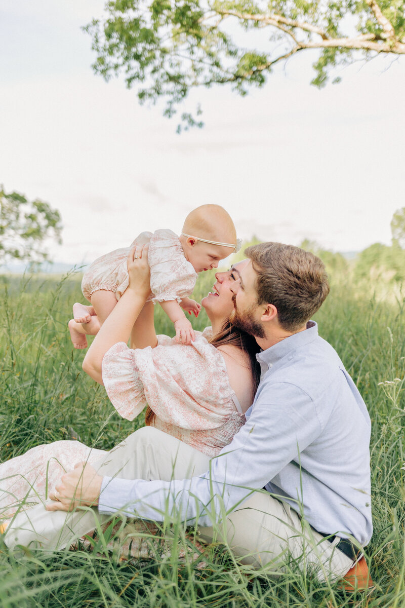Asheville family photographer captures couple with their baby girl at the Biltmore Estate in Asheville, NC