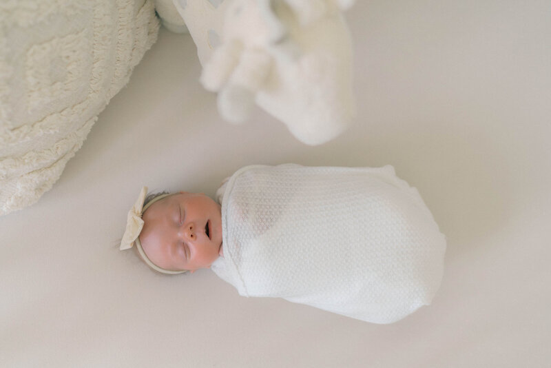 Light-filled lifestyle newborn session captured by a Salt Lake City newborn photographer.