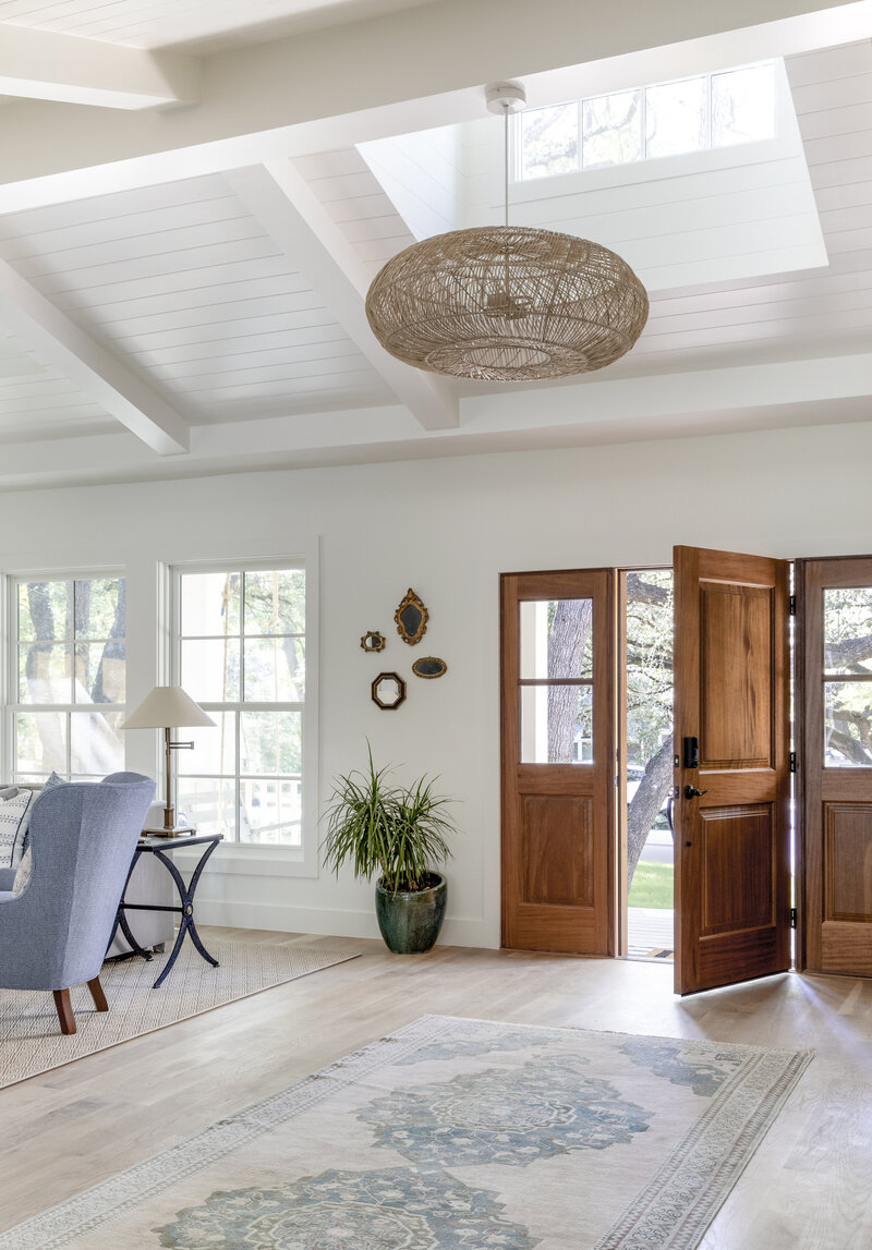 Beautiful 1940's cottage renovation in Tarrytown. There are large skylights over this entryway making the living space feel bright and open.