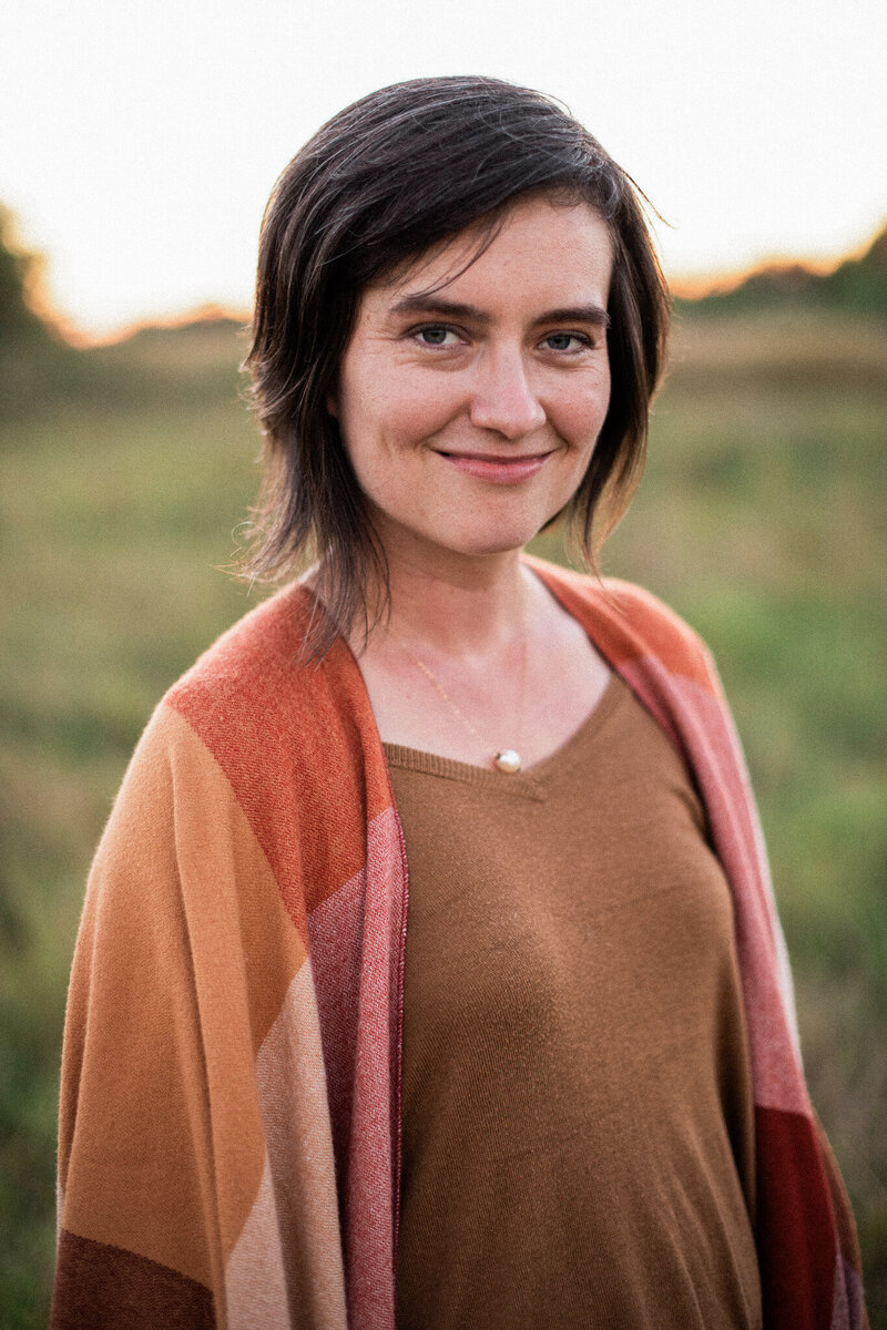 Stephanie Eddy, your Boulder Colorado wedding photographer, smiles at the camera