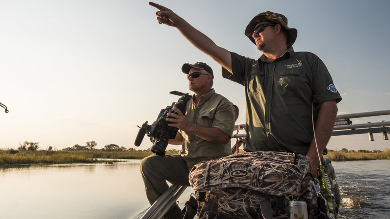 Rick Westphal and Corne Kruger on the Cuando River in Namibia filming elephants and hippos with Omujeve Safaris and Raven 6 Studios