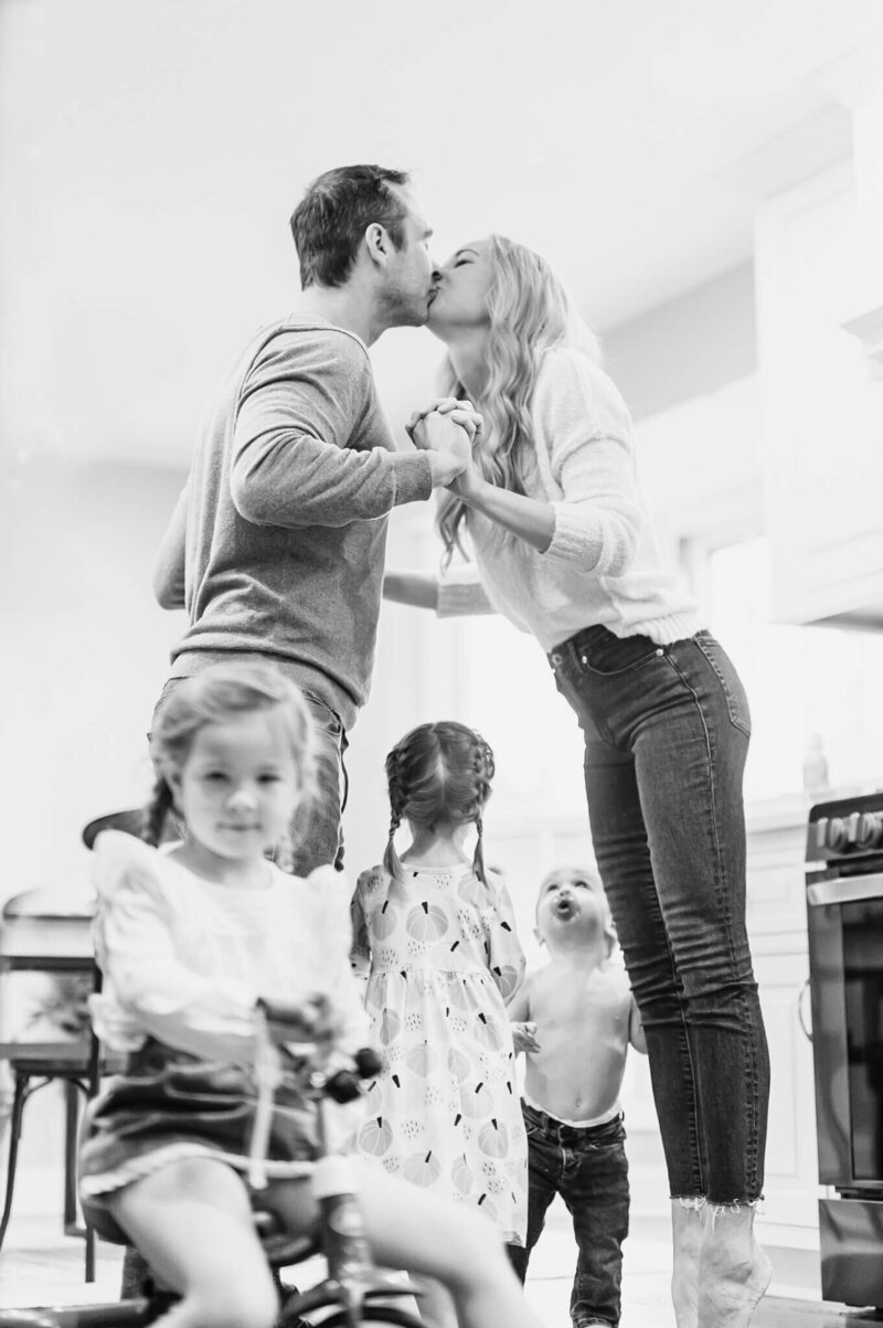 Two sisters dancing at an in home family photo session near Chicago.