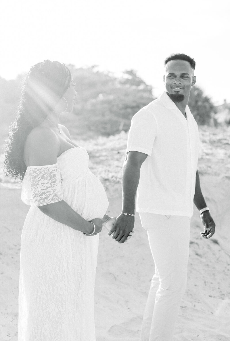 black and white maternity photo on the beach