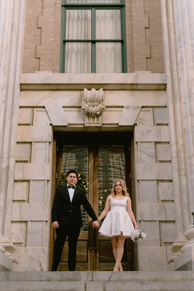 bride and groom on the steps of le meridien tampa