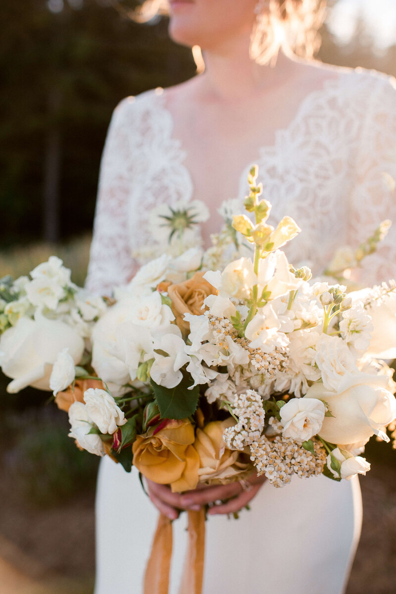 Bride holding bouquet at Saltwater Farms on Whidbey Island