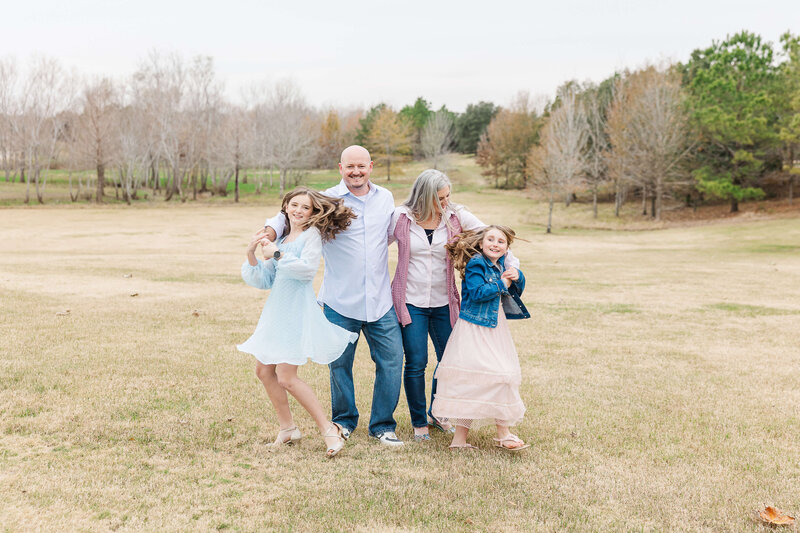 Family of four sitting in a park