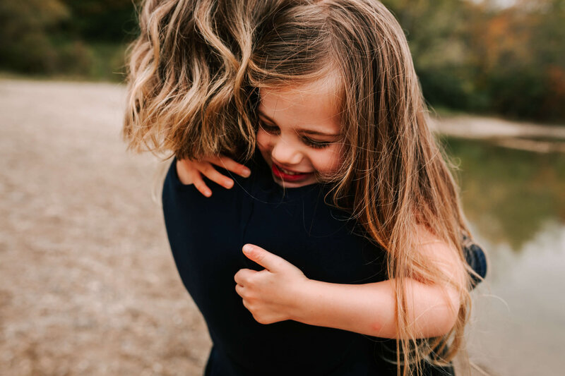 Daughter holds onto Mom tightly during her Guelph Family Session