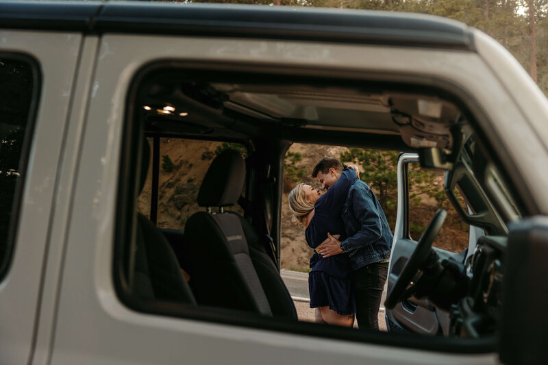 Couple Hugging Through Car Window