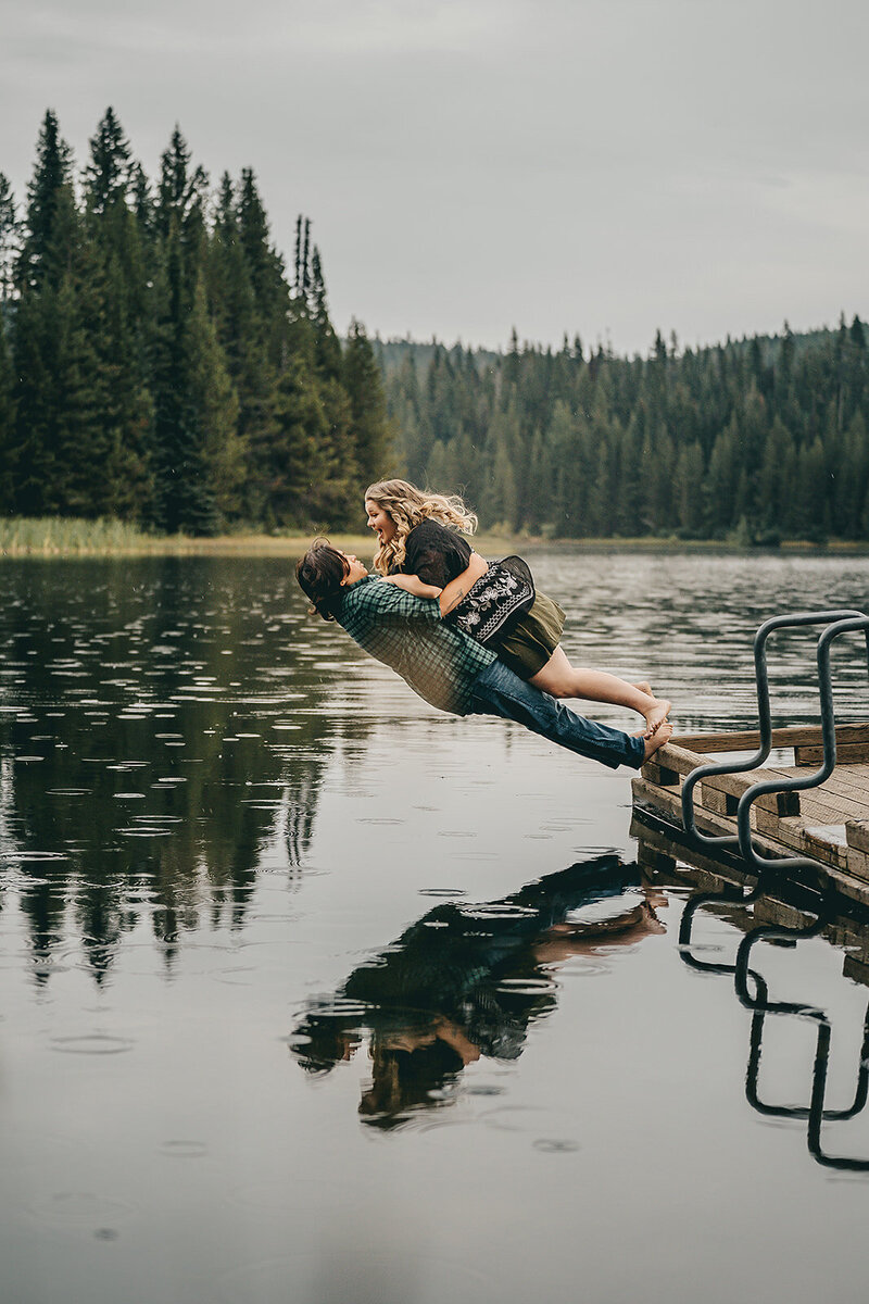 Couple photography, a couple dives into the bay during their adventure sessions