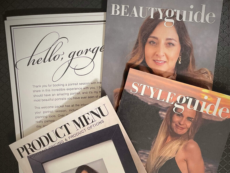 Assortment of client welcome materials for portrait photography sessions, featuring a 'Hello, Gorgeous' greeting card, Beauty and Style Guides, and a Product Menu with portrait pricing options