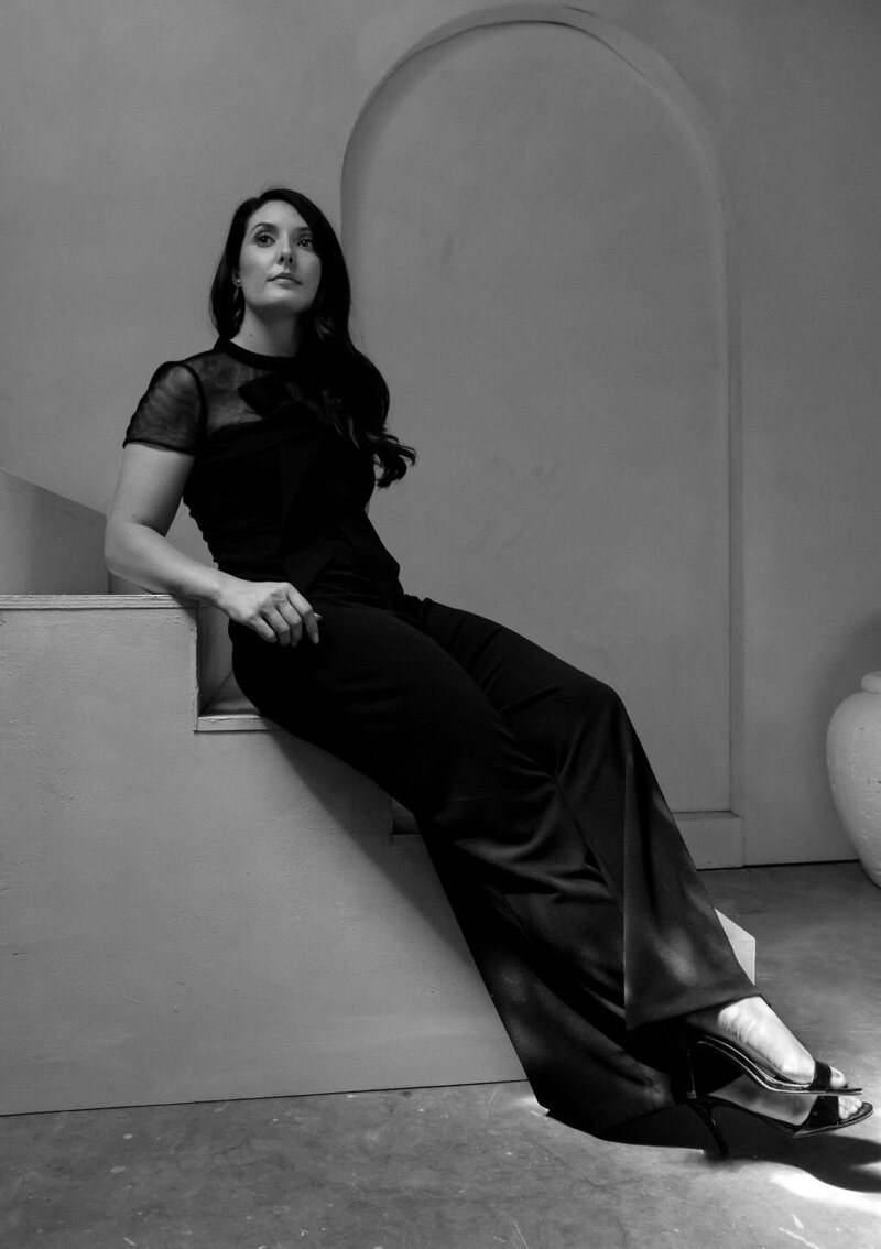 Makeup artist Sarah in a long black dress