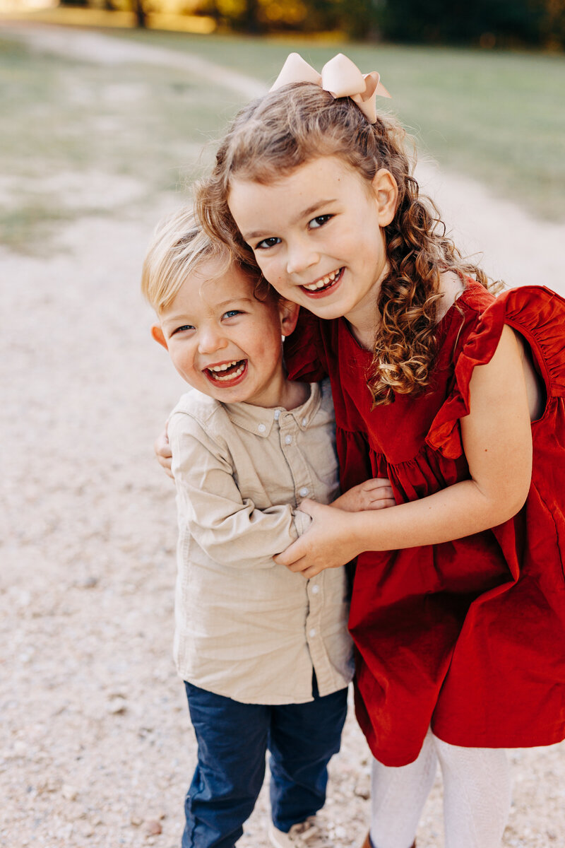 siblings hugging during a family photography session