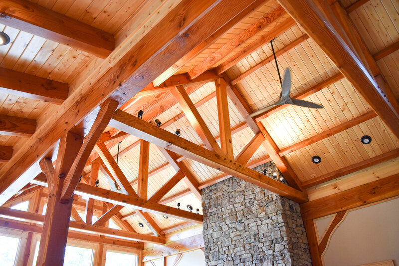 king post truss, post and beam timber frame home interior.