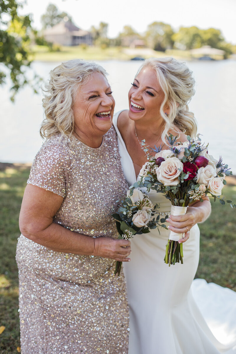 bride hugging and laughing with her mom on Knoxville wedding day