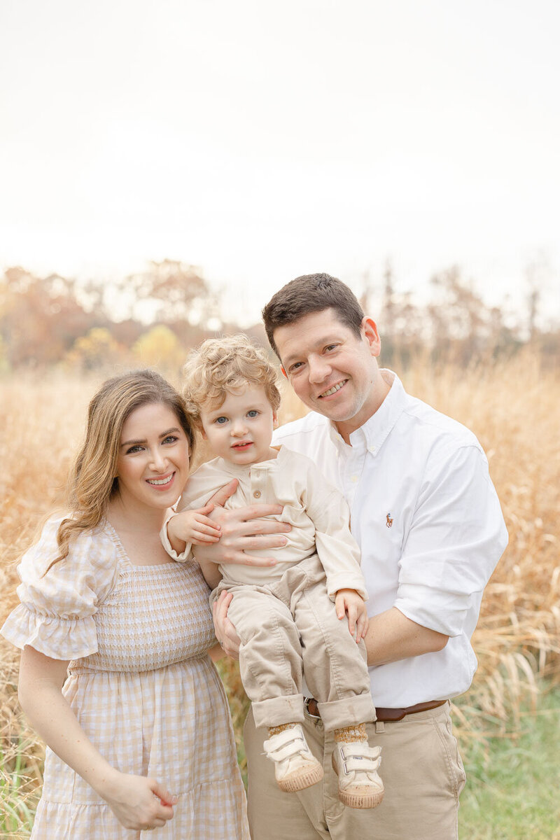 Family of 3 smiling for Manassas, Virginia pictures